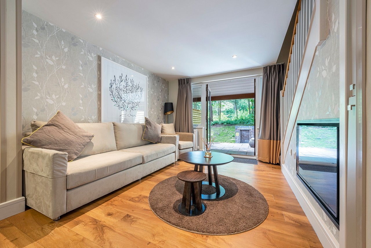 Living space and outdoor terrace in the Spa Break apartment.